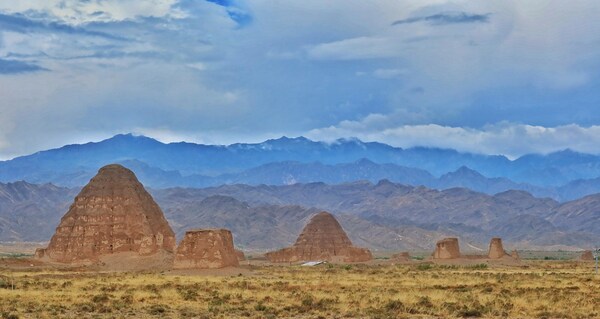 A panorama of Mausoleums No 1 (front) and No 2 of the Xixia Imperial Tombs, set against the majestic backdrop of the Helan Mountains. [Photo by Jiang Dong China Daily]