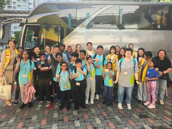 Volunteers and child volunteers from the Lions Club of Singapore Lotusia with children from MINDS Raintree SSCC